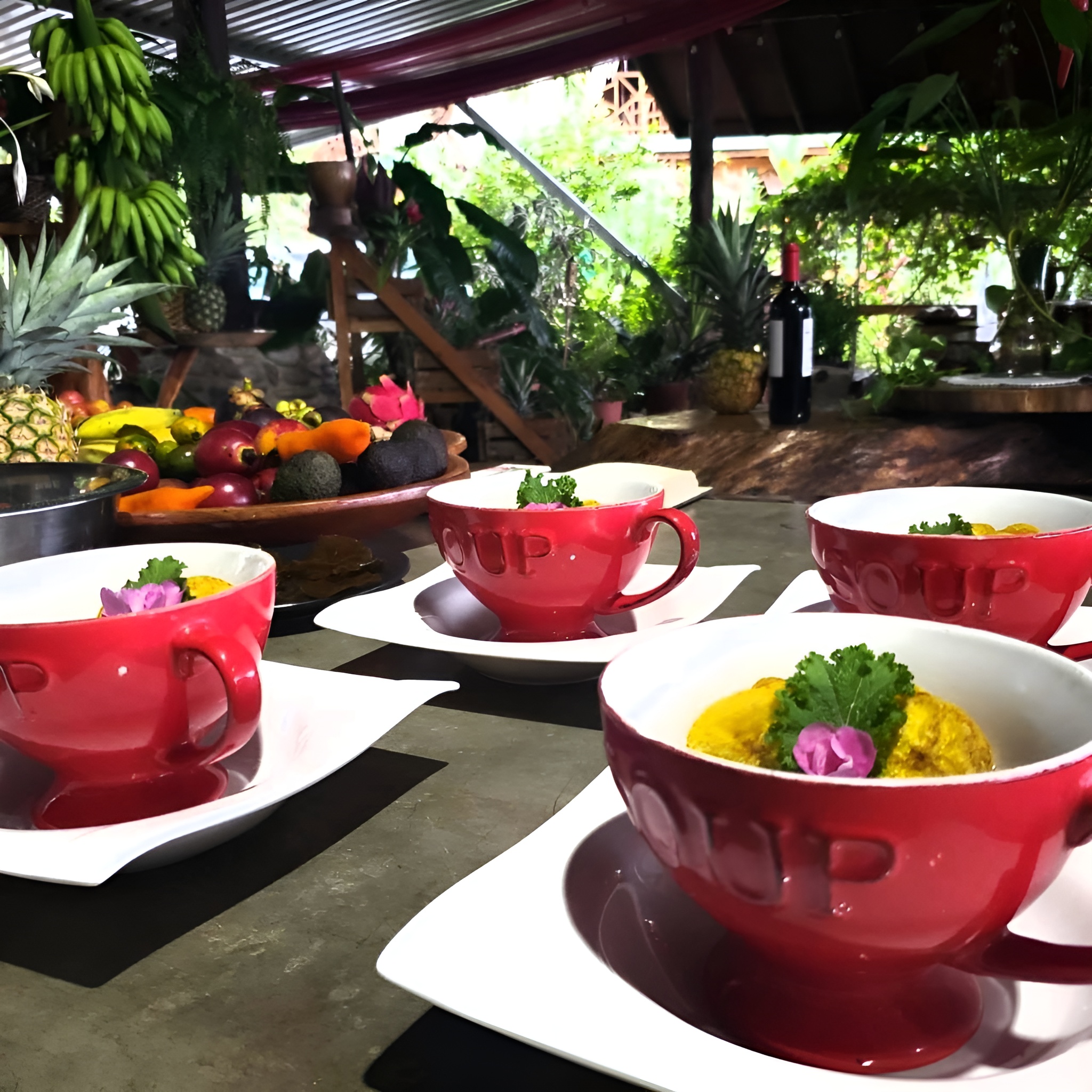 Garden-fresh soup course with tropical fruit display